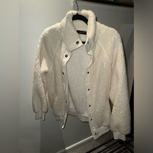 Brand new, never worn. Fluffy cream button up jacket